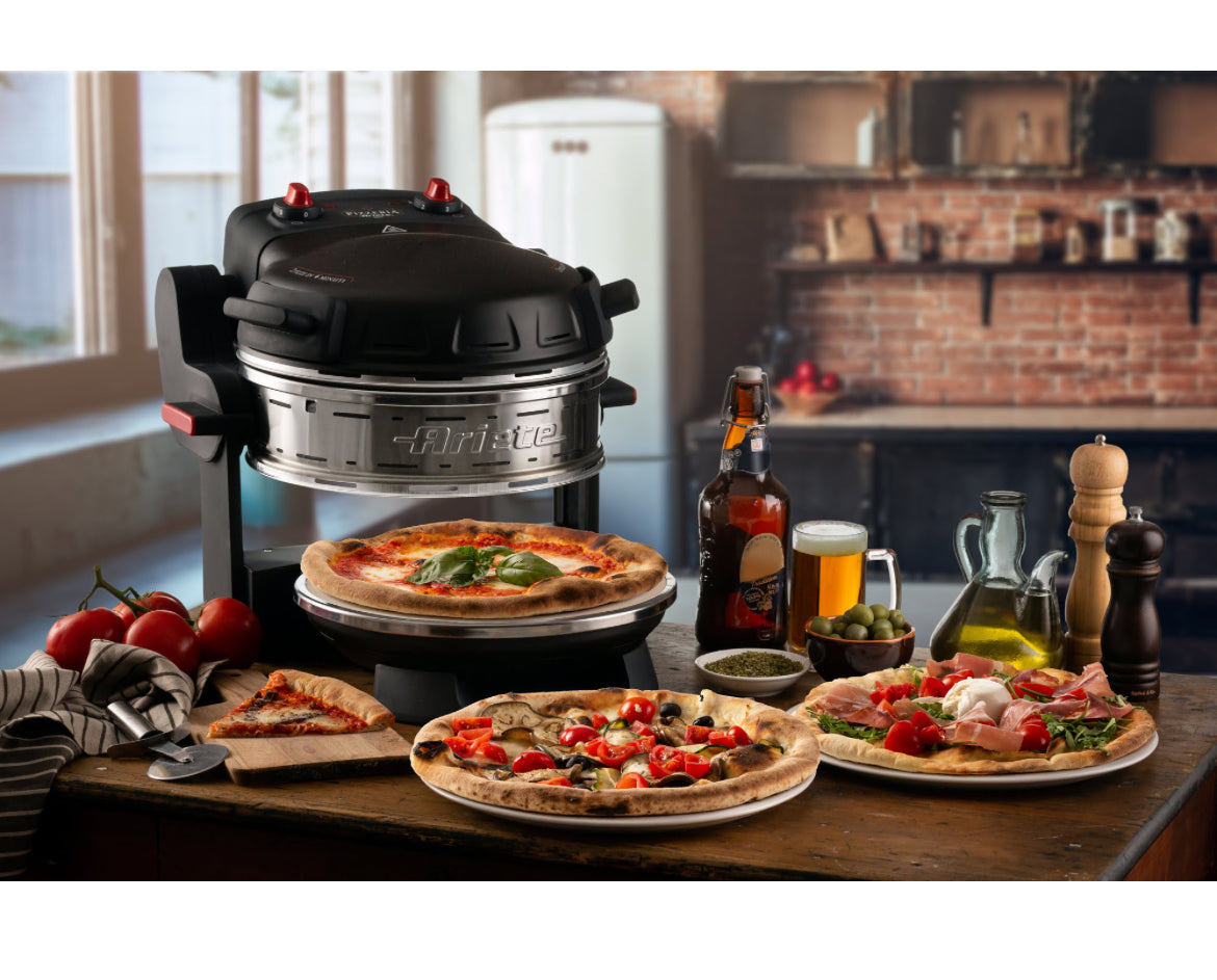 Pizzeria Ariete Nero
0927/01
Forno elettrico per 2 pizze con 2 pietre refrattarie di 32 cm di diametro con trattamento antiaderente. 2 termostati separati. 5 livelli di cottura. Temperatura massima 400°. Ideale per cuocere 2 pizze contemporaneamente. Nero